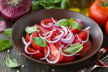 Tomato salad with sweet red onion and basil
