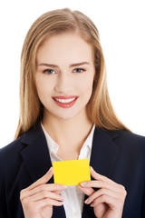 Beautiful smiling businesswoman with businesscard