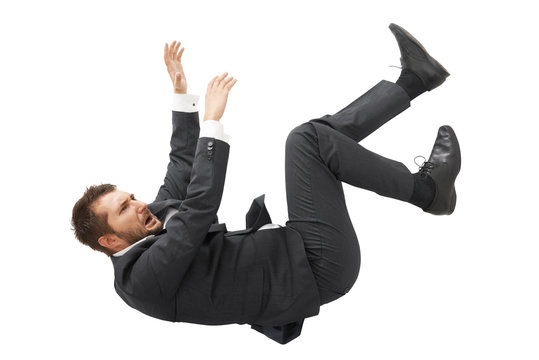 businessman in black suit falling down