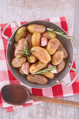 fried potato with garlic and rosemary