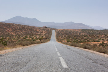 Straight road through the desert in Morocco, Africa