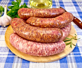 Sausages pork and beef on blue cloth