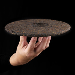 Woman's hand holding a frying pan.