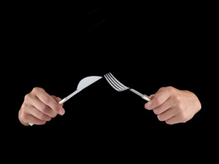 Woman's hand holding a frying pan.