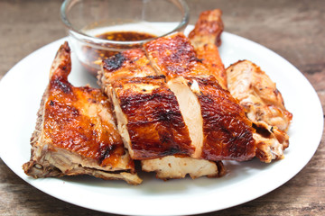 Grilled chicken on plate.