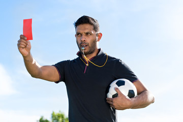 Referee with red card
