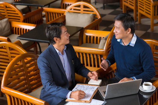 Discussing business plan - Powered by Adobe