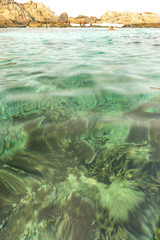 Fototapeta na wymiar Rock island and clear water with low angle view