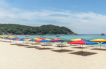 Fototapeta na wymiar Tropical beach with shade umbrella