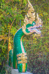 Obraz premium Naga sculpture on the wall in the temple.