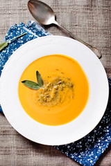Pumpkin cream soup with sage and nuts pesto