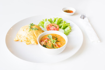 Delicious rice and red curry with pork and omelet (Thai panang c