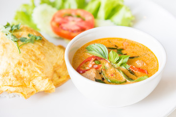 Delicious rice and red curry with pork and omelet (Thai panang c