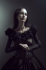 Obraz na płótnie Canvas Gothic portrait of mourning woman in black dress