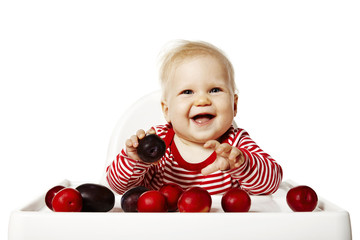 Baby Is Selecting Plums - 70386660
