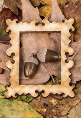 wooden picture frame on autumn leaves