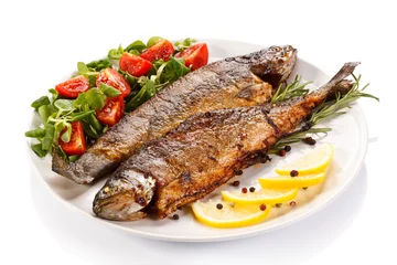 Foto auf Acrylglas Fertige gerichte Fish dish - fried fish fillet with vegetables