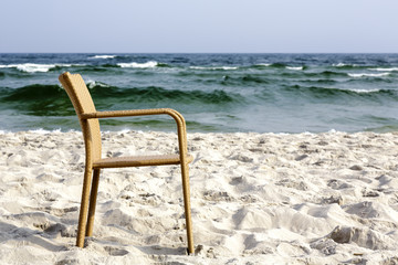 A chair on an empty beach
