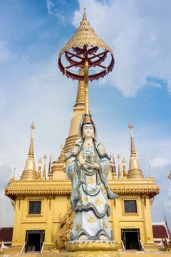 Guan Yin statue with blue sky, Thailand