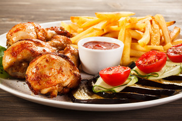 Grilled chicken legs with vegetables