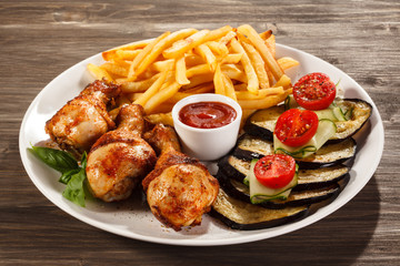 Grilled chicken legs with vegetables