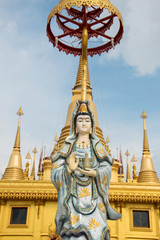 Guan Yin statue with blue sky, Thailand