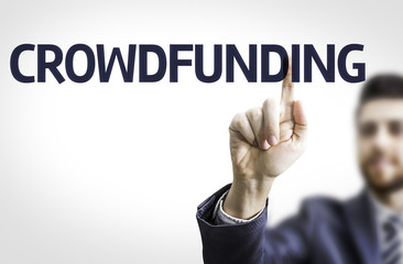 Business man pointing the text: Crowdfunding