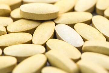 Fototapeta na wymiar vitamin C pills closeup macro