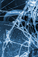 Broken windscreen at black car in traffic accident