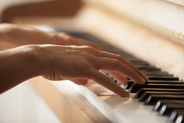 woman hands playing piano - Powered by Adobe