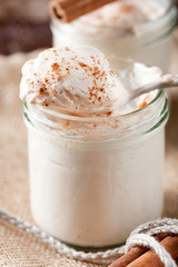 Baked milk yogurt with cinnamon in glass jars