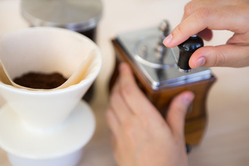 Fototapeta na wymiar Woman hand of barista preparation drip coffee