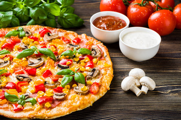 Pizza on wooden table