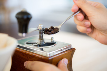 Woman hand of barista preparation drip coffee