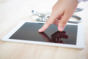 Doctor using tablet computer