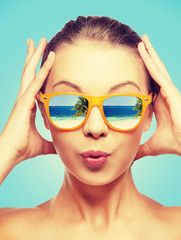 amazed teenage girl in sunglasses