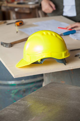 Hardhat On Wooden Plank