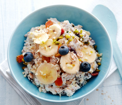 Bowl of breakfast cereal topped with fruit