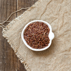 Raw red rice in a bowl