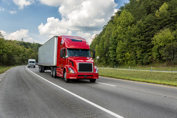 Fototapeta na wymiar Red Semi Truck On An Interstate Highway