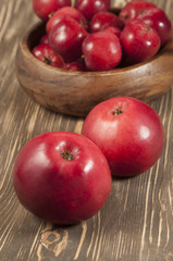 Red apples in a timber bowl