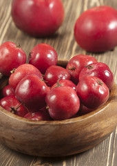 Red apples in a timber bowl