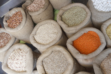 Fototapeta na wymiar Beans, rice, lentils, oats, wheat, rye and barley in jute sack