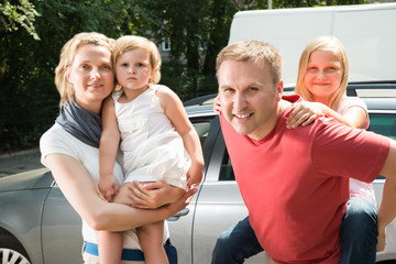 Happy Family Traveling By Car
