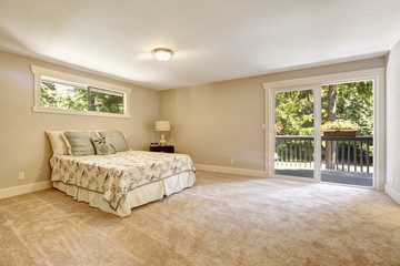 Spacious bedroom interior with walkout deck
