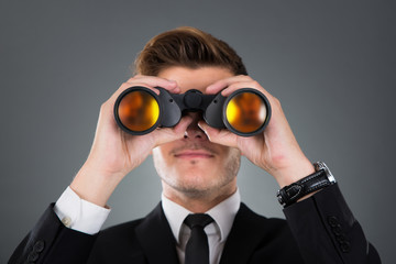 Businessman Looking Through Binoculars