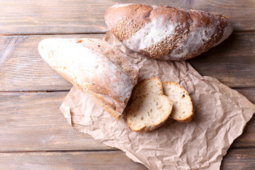 Fresh bread on wooden background