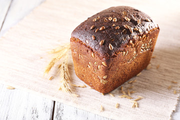 Fresh bread on wooden table, close up