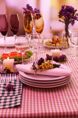 Buffet table with dishware waiting for guests