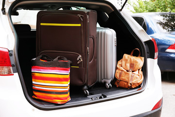 Suitcases and bags in trunk of car ready to depart for holidays © Africa Studio